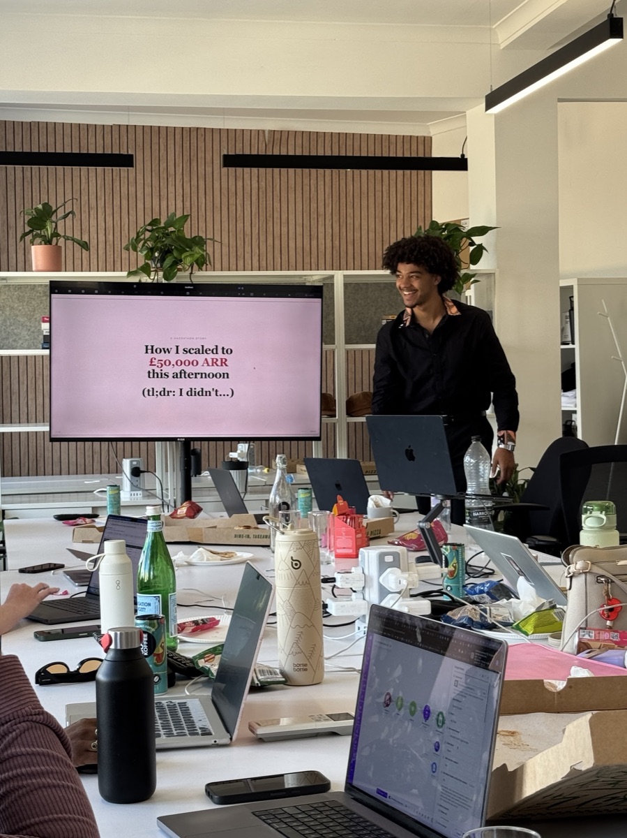 Efan Mutembo presenting at the Make.com hackathon
